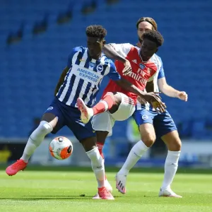 Bukayo Saka vs. Yves Bissouma: A Battle in the Empty Arsenal Stadium