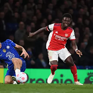 Bukayo Saka's Sensational Skills: Outmaneuvering Marcos Alonso in the Premier League Showdown at Stamford Bridge, 2021-22