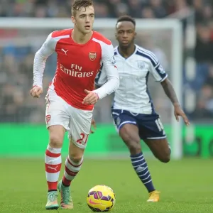 Calum Chambers Outmaneuvers Saido Berahino: A Premier League Clash between West Bromwich Albion and Arsenal