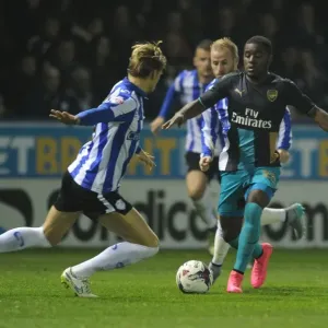 Campbell vs Loovens: A Football Rivalry in the Capital One Cup - Sheffield Wednesday vs Arsenal