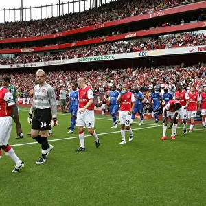 Captain Kolo Toure leads out the Arsenal team