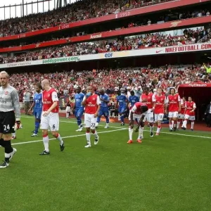 Captain Kolo Toure leads out the Arsenal team Captain Kolo Toure leads out the Arsenal team