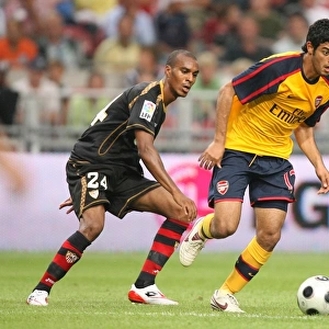 Carlos Vela (Arsenal) Abdoulay Konko (Seville)