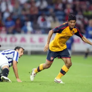 Carlos Vela (Arsenal) Andy Holdsworth (Huddersfield) Carlos Vela (Arsenal) Andy Holdsworth (Huddersfield)