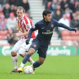 Carlos Vela (Arsenal) Glenn Whelan (Stoke). Stoke City 3: 1 Arsenal, FA Cup 4th round Carlos Vela (Arsenal) Glenn Whelan (Stoke). Stoke City 3: 1 Arsenal, FA Cup 4th round