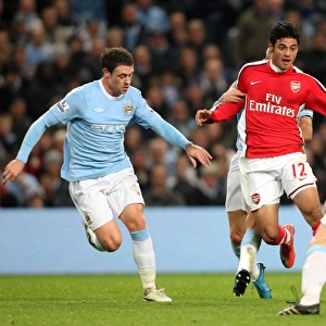 Carlos Vela (Arsenal) Wayne Bridge and Gareth Barry (Man City). Manchester City 3