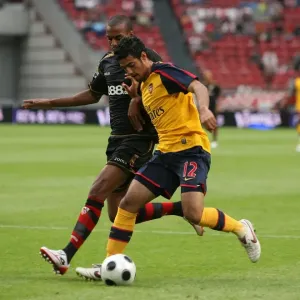 Carlos Vela beats Seville defender Abdoulay Konko to Carlos Vela beats Seville defender Abdoulay Konko to