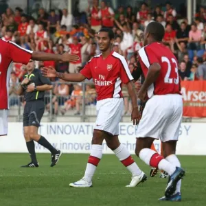 Carlos Vela celebrates his 2nd goal iwth Theo Walcott and Jay Simpson