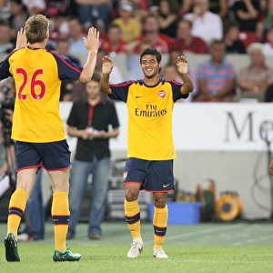 Carlos Vela celebrates scoring for Arsenal with Nicklas Bendtner