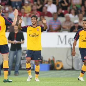 Carlos Vela celebrates scoring for Arsenal with Nicklas Bendtner