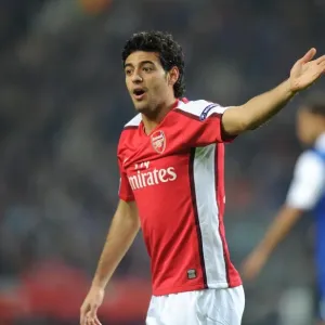 Carlos Vela Leads Arsenal in First Leg of UEFA Champions League Clash Against FC Porto