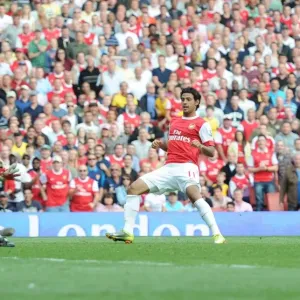 Carlos Vela shoots past Bolton goalkeeper Adam Bogdan to score the 4th Arsenal goal