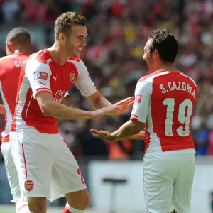 Cazorla and Chambers Celebrate Arsenal's First Goal Against Manchester City - FA Community Shield 2014/15 Cazorla and Chambers Celebrate Arsenal's First Goal Against Manchester City - FA Community Shield 2014/15
