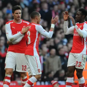 Celebrating Glory: Giroud, Gibbs, and Welbeck Rejoice in Arsenal's 2-0 FA Cup Victory