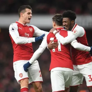 Celebrating Glory: Ozil, Xhaka, and Maitland-Niles Rejoice in Arsenal's Goal vs. Newcastle United (2017-18) Celebrating Glory: Ozil, Xhaka, and Maitland-Niles Rejoice in Arsenal's Goal vs. Newcastle United (2017-18)