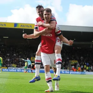 Celebrating Glory: Ramsey and Jenkinson's Unforgettable Goal Connection (Norwich City vs. Arsenal, 2013-14)
