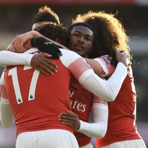 Celebrating a Goal: Iwobi and Maitland-Niles Rejoice after Arsenal's Third against Burnley