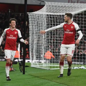 Celebrating Goal: Ozil and Ramsey Rejoice After Sanchez's Strike in Arsenal's Victory vs. Huddersfield Town Celebrating Goal: Ozil and Ramsey Rejoice After Sanchez's Strike in Arsenal's Victory vs. Huddersfield Town