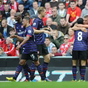 Celebrating a Goal: Podolski, Arteta, Mertesacker, Diaby, and Oxlade-Chamberlain (Liverpool vs Arsenal, 2012-13) Celebrating a Goal: Podolski, Arteta, Mertesacker, Diaby, and Oxlade-Chamberlain (Liverpool vs Arsenal, 2012-13)