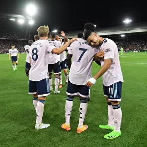 Celebrating Victory: Arsenal's Bukayo Saka, Martin Odegaard, and Gabriel Martinelli Rejoice After Scoring Against Crystal Palace (Premier League 2022-23)