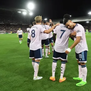 Celebrating Victory: Arsenal's Bukayo Saka, Martin Odegaard, and Gabriel Martinelli Rejoice After Scoring Against Crystal Palace (Premier League 2022-23)