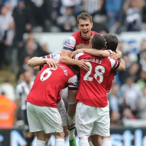 Celebrating Victory: Arsenal's Koscielny, Mertesacker, Ramsey, Gibbs, and Rosicky Celebrating Victory: Arsenal's Koscielny, Mertesacker, Ramsey, Gibbs, and Rosicky