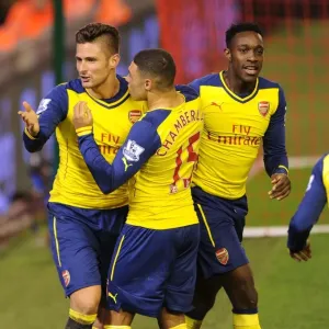Celebrating Victory: Giroud, Oxlade-Chamberlain, and Welbeck Rejoice After Arsenal's Goals vs. Liverpool (2014/15) Celebrating Victory: Giroud, Oxlade-Chamberlain, and Welbeck Rejoice After Arsenal's Goals vs. Liverpool (2014/15)
