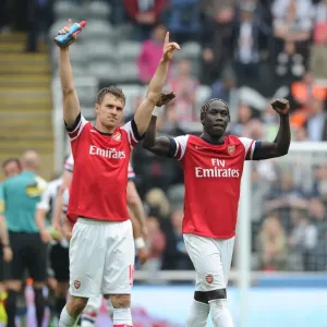 Celebrating Victory: Ramsey and Sagna's Moment of Triumph after Arsenal's Win at Newcastle United (2012-13) Celebrating Victory: Ramsey and Sagna's Moment of Triumph after Arsenal's Win at Newcastle United (2012-13)