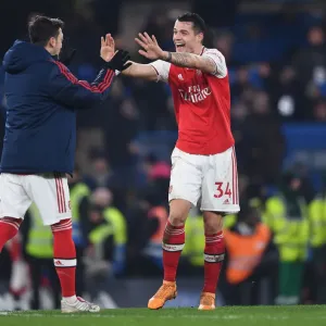 Celebrating Victory: Xhaka and Ozil Reunite in Arsenal's Chelsea Win (2019-20)