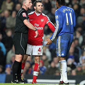 Cesc Fabregas (Arsenal) Didier Drogba (Chelsea) and Referee Mike Dean. Chelsea 2