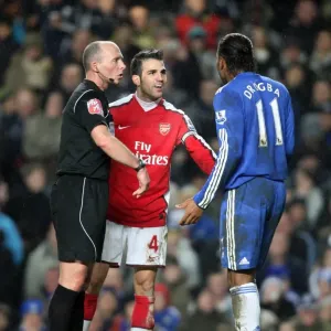 Cesc Fabregas (Arsenal) Didier Drogba (Chelsea) and Referee Mike Dean. Chelsea 2