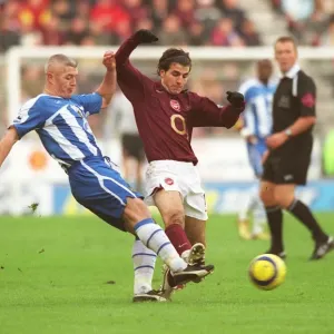 Cesc Fabregas (Arsenal) Graham Kavanagh (Wigan)