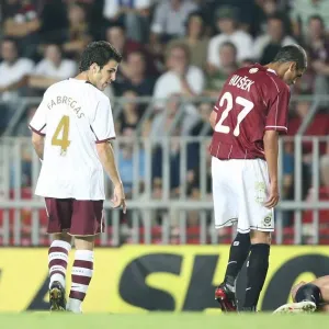 Cesc Fabregas (Arsenal) looks at injured Sparta Prague captain Tomas Repka Cesc Fabregas (Arsenal) looks at injured Sparta Prague captain Tomas Repka