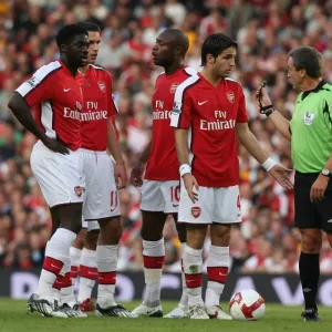 Cesc Fabregas (Arsenal) and referee Alan Wiley Cesc Fabregas (Arsenal) and referee Alan Wiley