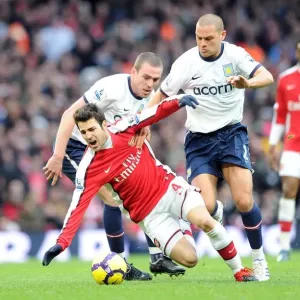 Cesc Fabregas (Arsenal) Richard Dunne and Luke Young (Aston Villa). Arsenal 3 Cesc Fabregas (Arsenal) Richard Dunne and Luke Young (Aston Villa). Arsenal 3