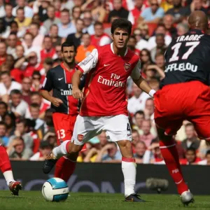 Cesc Fabregas (Arsenal) Sammy Traore (PSG) Cesc Fabregas (Arsenal) Sammy Traore (PSG)