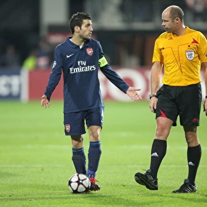 Cesc Fabregas (Arsenal) talks with referee during the match