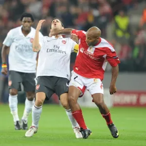 Cesc Fabregas (Arsenal) Wilfried Dalmat (Standard Liege) Cesc Fabregas (Arsenal) Wilfried Dalmat (Standard Liege)