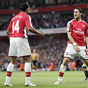 Cesc Fabregas celebrates Arsenals goal with Theo Walcott