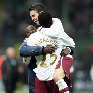 Cesc Fabregas celebrates with Emmanuel Eboue and Emmanuel Adebayor