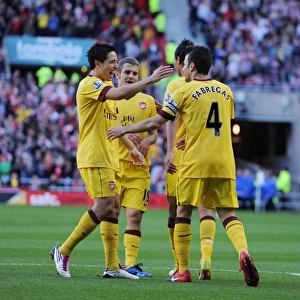 Cesc Fabregas celebrates scoring the Arsenal goal with Samir Nasri, Marouane Chamakh