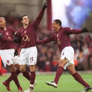 Cesc Fabregas celebrates scoring Arsenals 1st goal with Thierry Henry and Gilberto