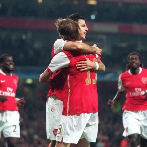 Cesc Fabregas celebrates scoring Arsenals 1st goal with Alex Hleb