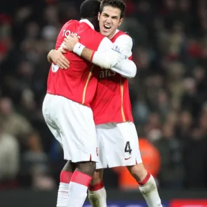 Cesc Fabregas and Kolo Toure (Arsenal) celebrate at the final whistle