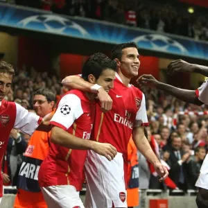 Cesc Fabregas, Robin van Persie celebrate the 1st Arsenal goal