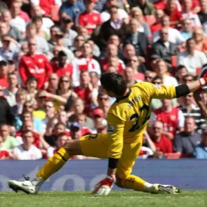 Cesc Fabregas rounds Brad Jones Cesc Fabregas rounds Brad Jones
