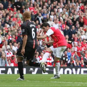 Cesc Fabregas shoots past Edwin van der Sar to score the 1st Arsenal goal