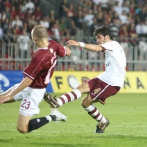 Cesc Fabregas shoots past Sparta goalkeeper Tomas Postulka to score the 1st Arsenal goal Cesc Fabregas shoots past Sparta goalkeeper Tomas Postulka to score the 1st Arsenal goal