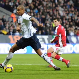 Cesc Fabregas shoots past Zat Knight to score the 1st Arsenal goal. Bolton Wanderers 0