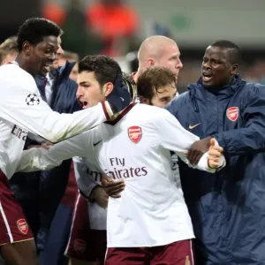 Cesc Fabregas and Teammates Celebrate First Goal: Arsenal's 2-0 Victory Over AC Milan in the UEFA Champions League